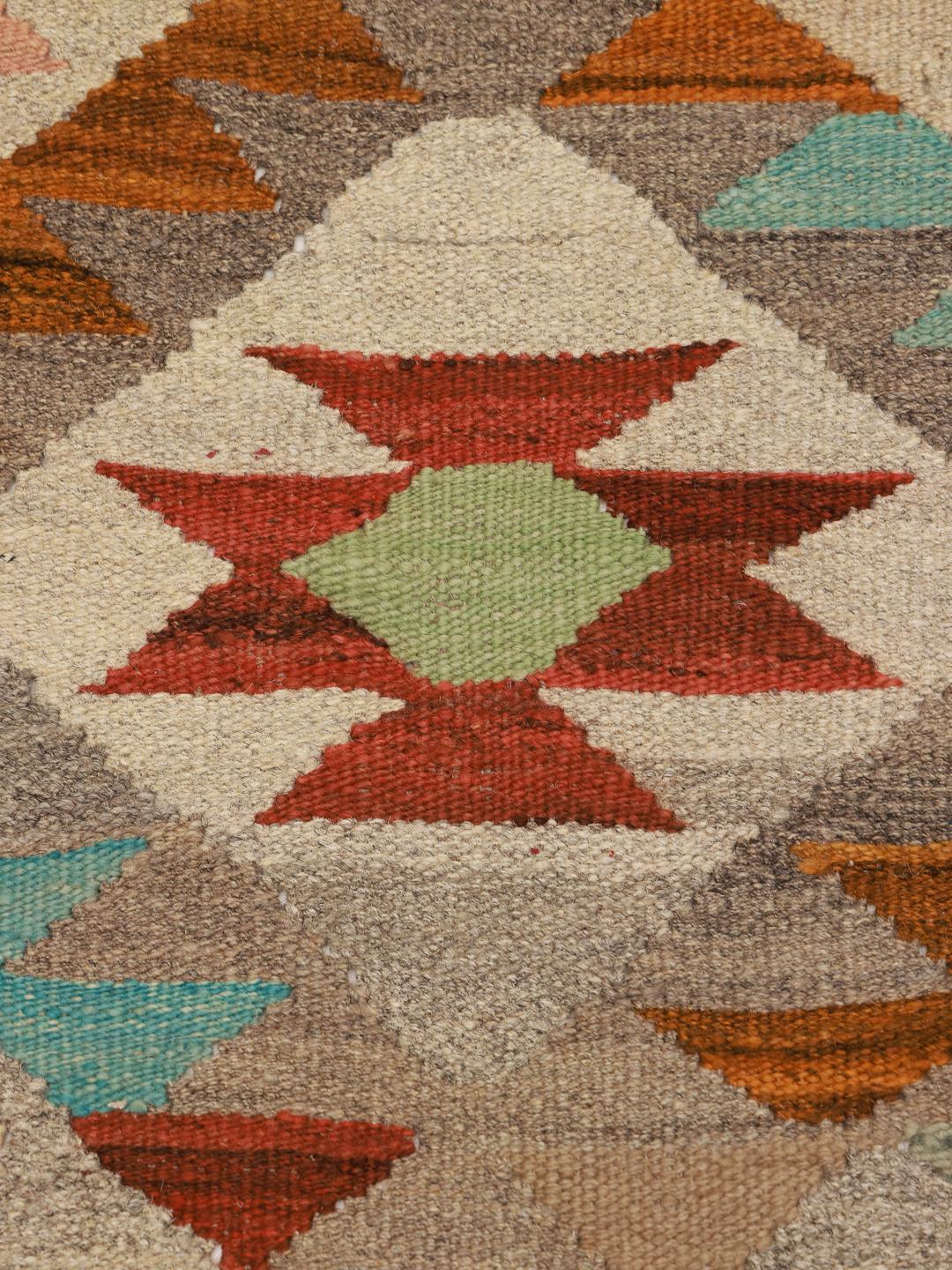 Hand-woven wool runner rug from Afghanistan in beige and multicolor