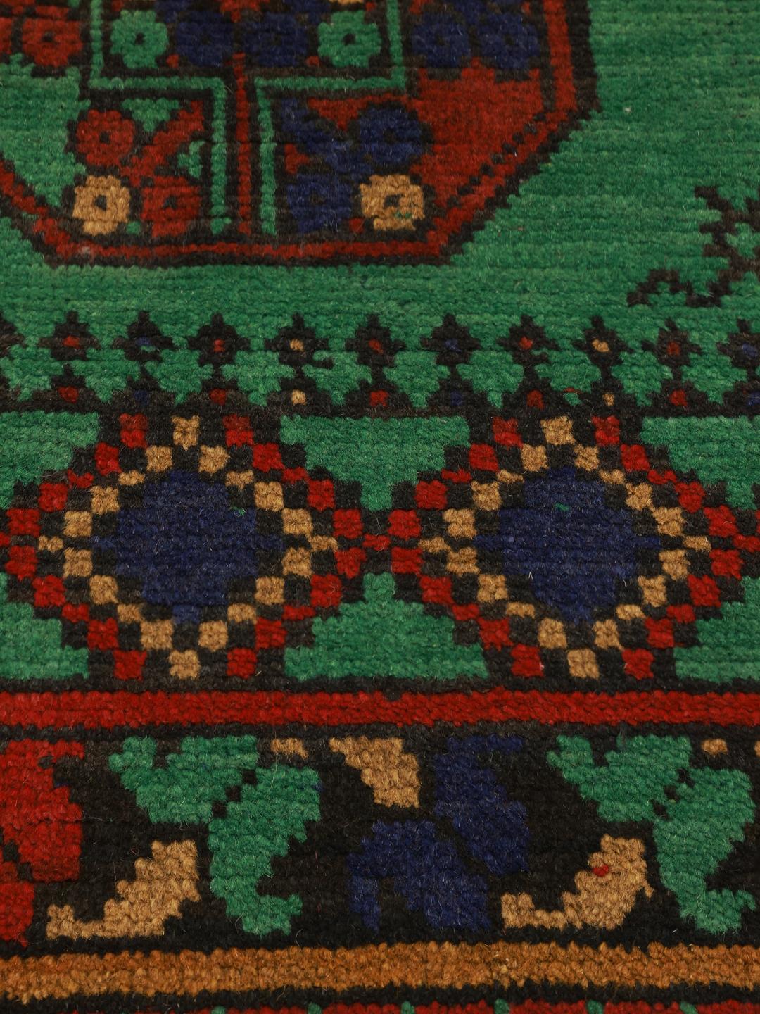 Hand-knotted wool rug from Afghanistan in green and red