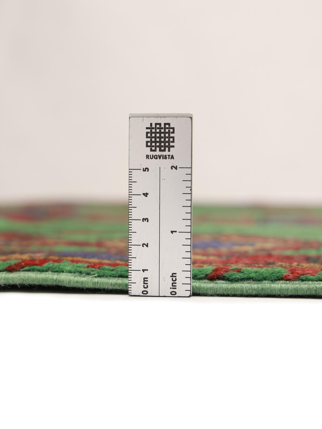 Hand-knotted wool rug from Afghanistan in green and red
