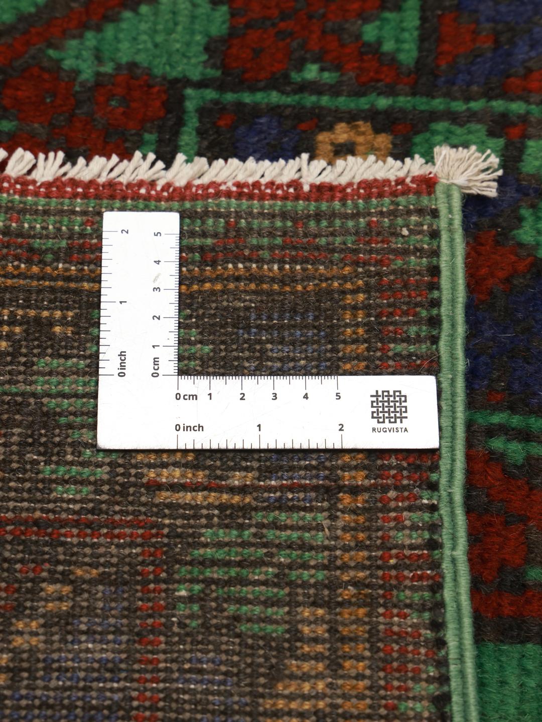 Hand-knotted wool rug from Afghanistan in green and red