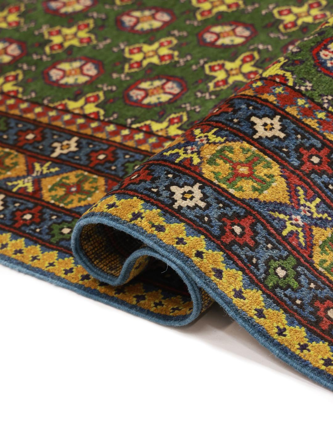 Handgeknoopt groen vloerkleed uit Afghanistan met geometrische patronen