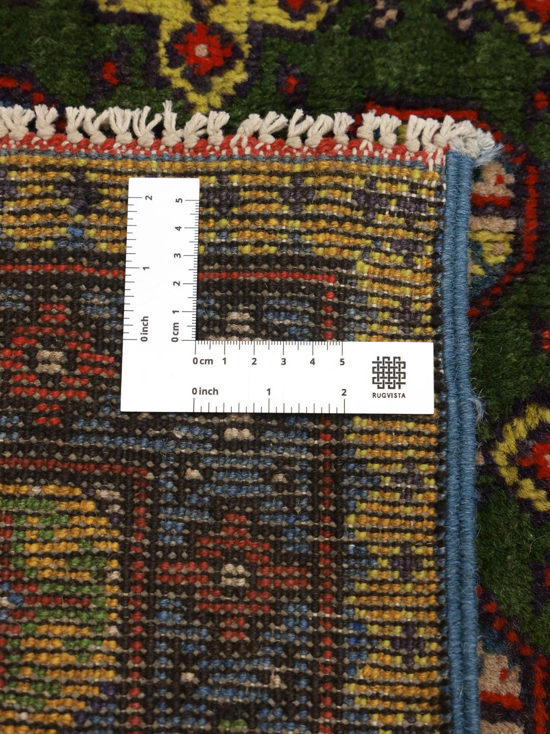 Handgeknoopt groen vloerkleed uit Afghanistan met geometrische patronen