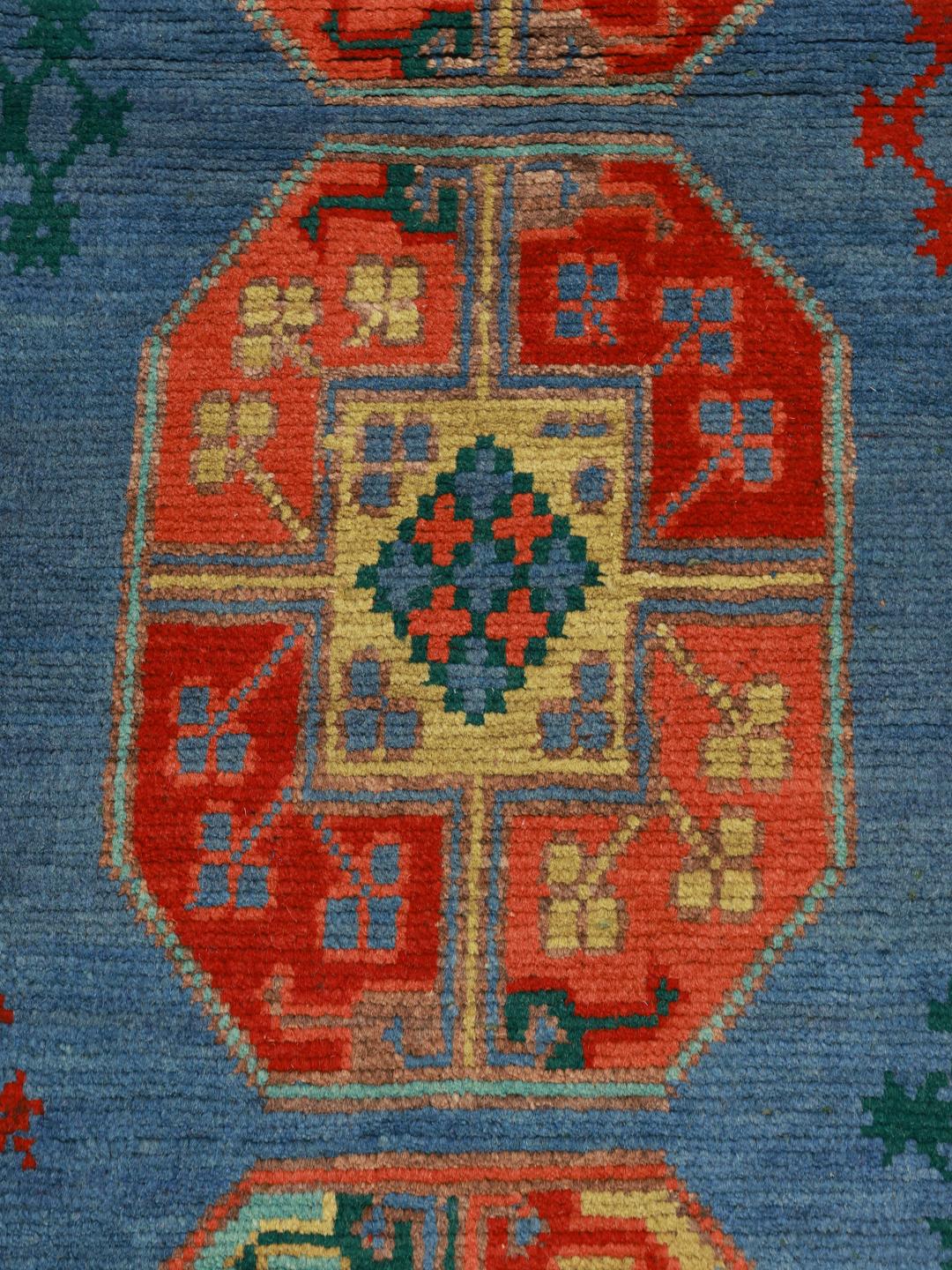 Handgeknoopt blauw vloerkleed uit Afghanistan met traditionele geometrische patronen