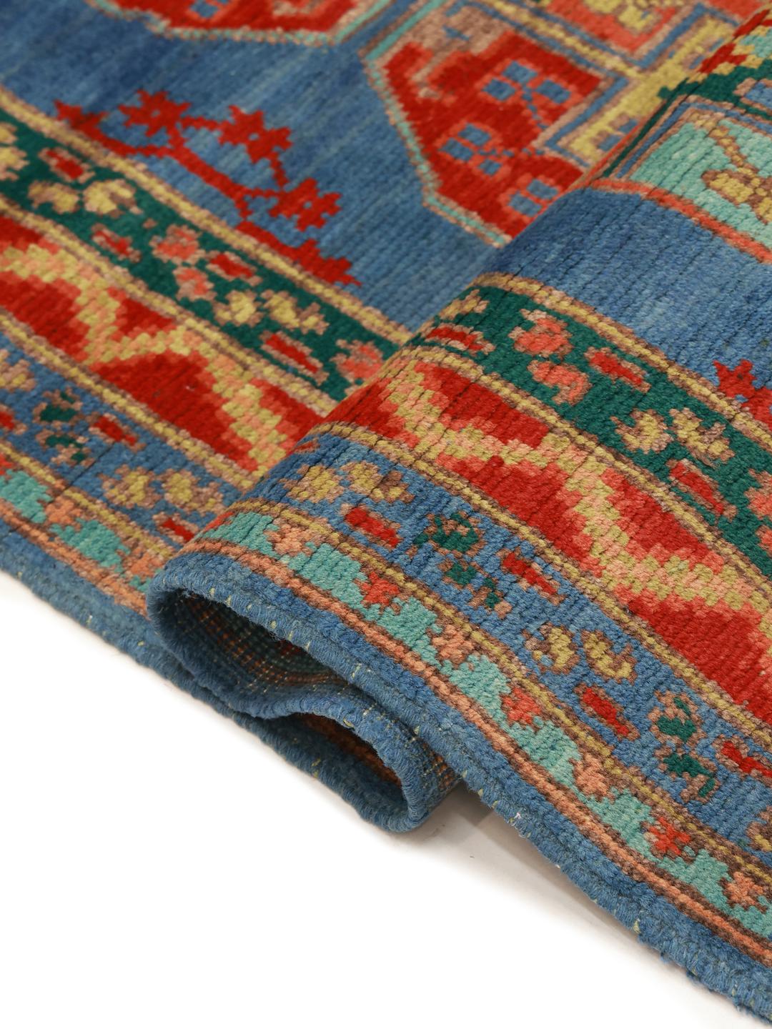 Handgeknoopt blauw vloerkleed uit Afghanistan met traditionele geometrische patronen