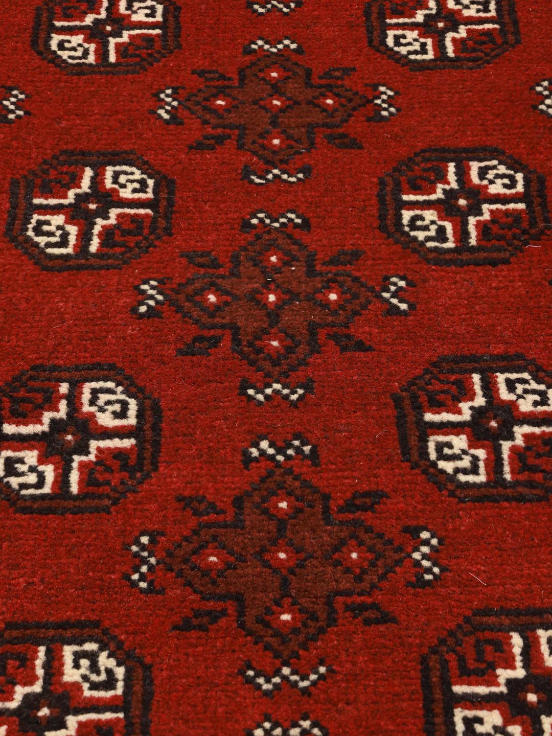 Hand-knotted Afghan Fine wool rug in red with tribal patterns