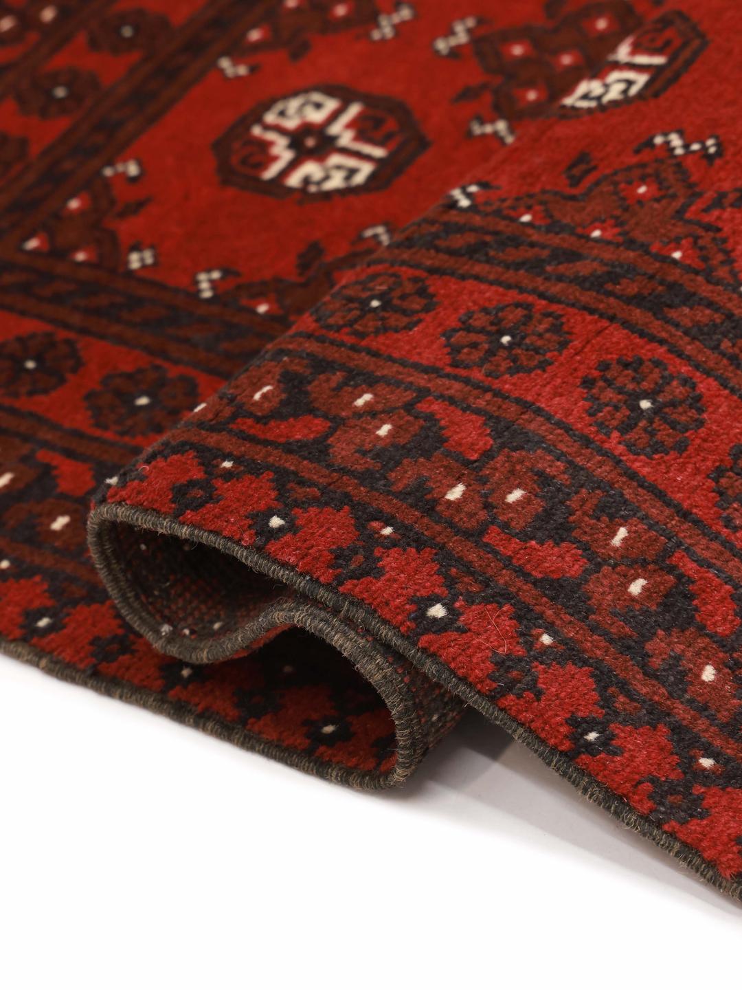 Hand-knotted Afghan Fine wool rug in red with tribal patterns