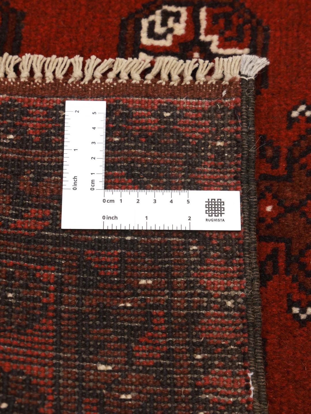 Hand-knotted Afghan Fine wool rug in red with tribal patterns