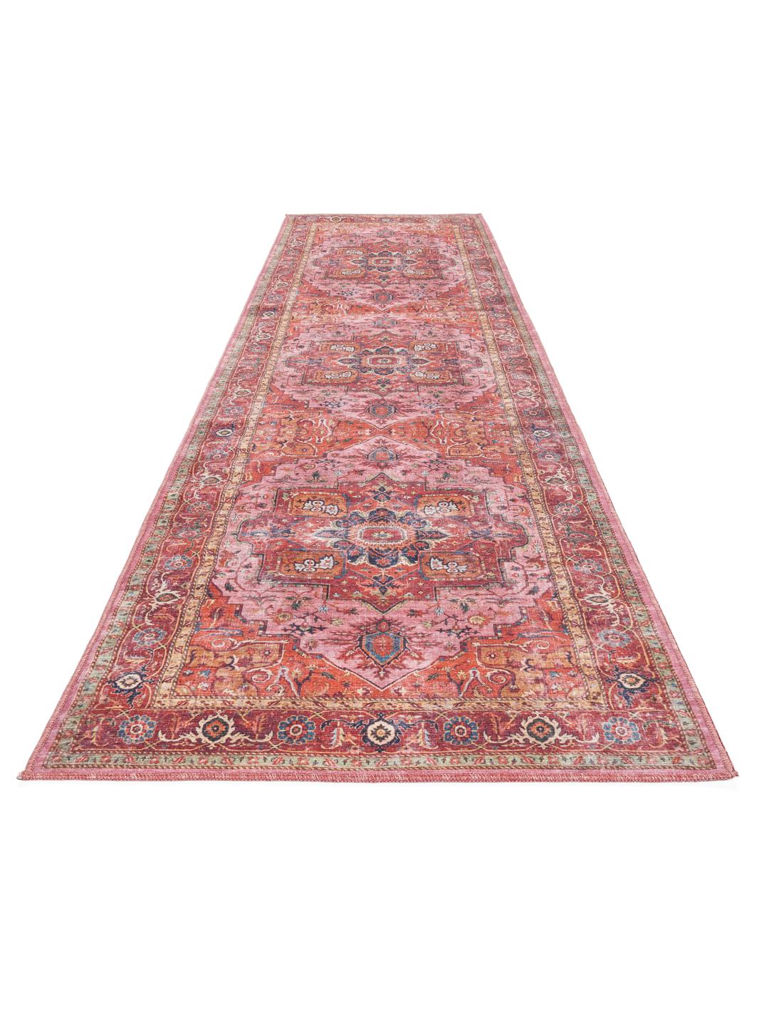 Red and pink runner rug with a central medallion design