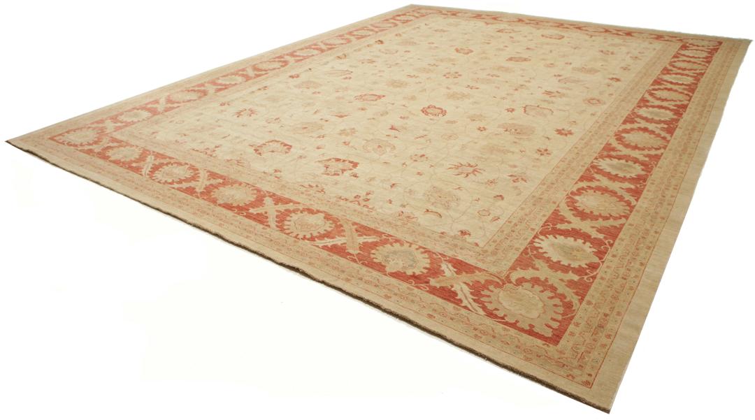 A large hand-knotted rug from Pakistan featuring a beige field and terracotta floral border.