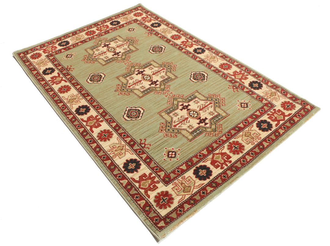 Lichtgroen en crèmekleurig beige vloerkleed met geometrisch patroon