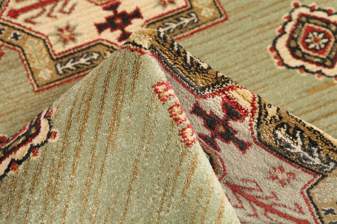 Lichtgroen en crèmekleurig beige vloerkleed met geometrisch patroon
