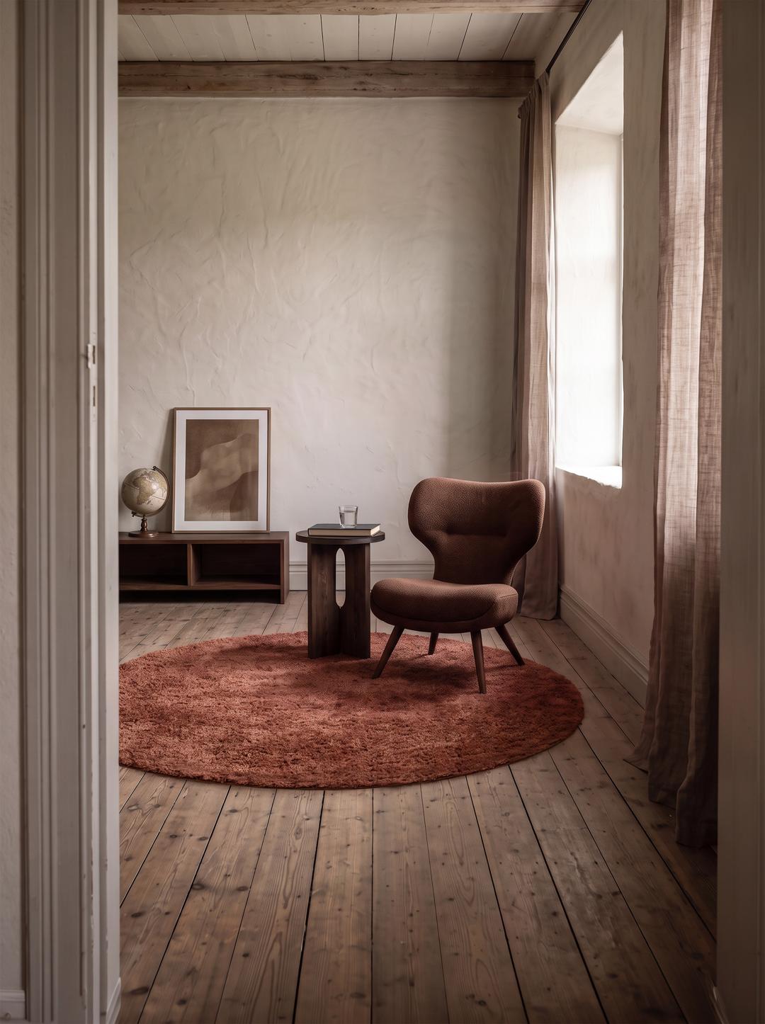 round rug in rust red