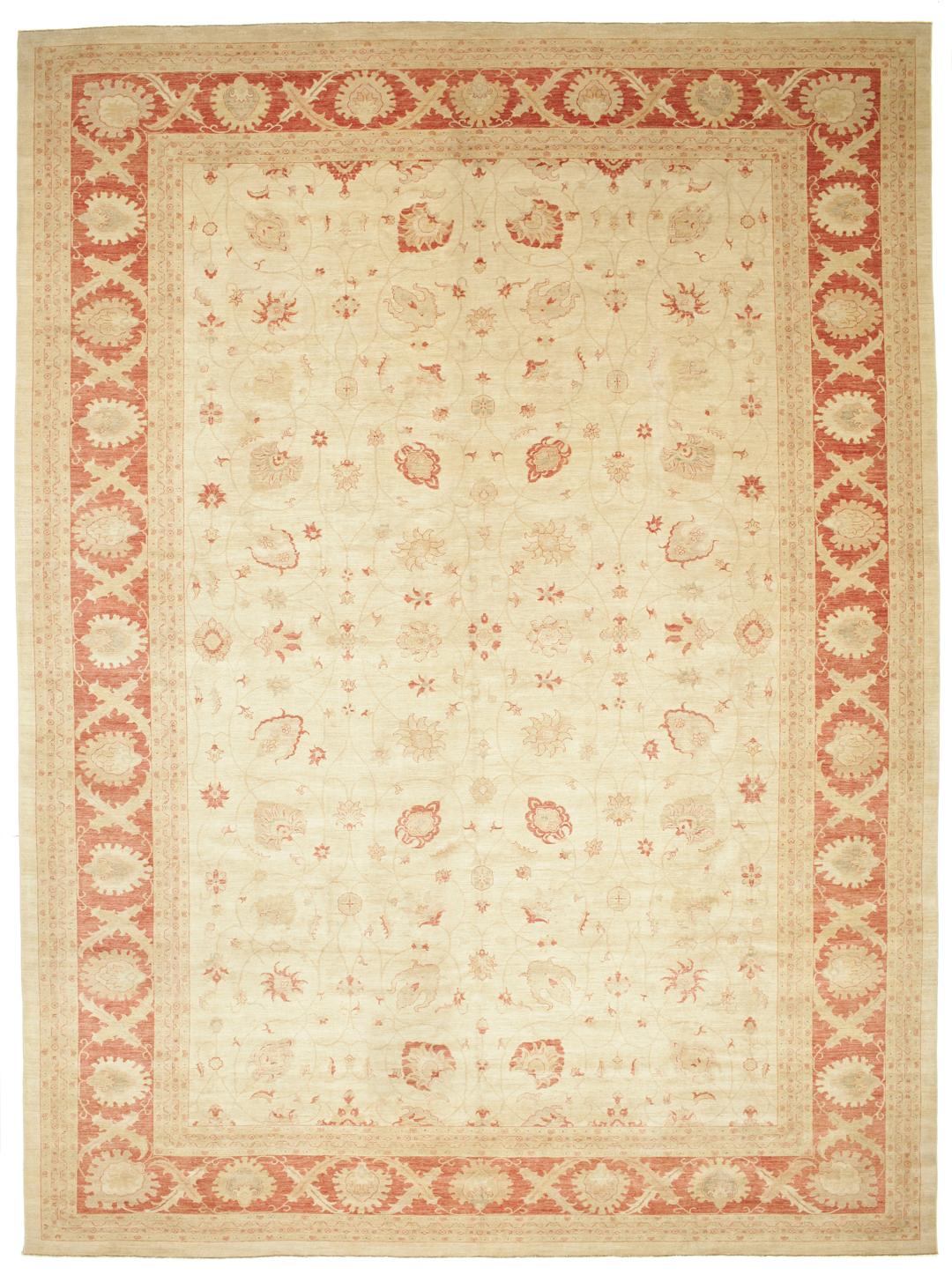 A large hand-knotted rug from Pakistan featuring a beige field and terracotta floral border.