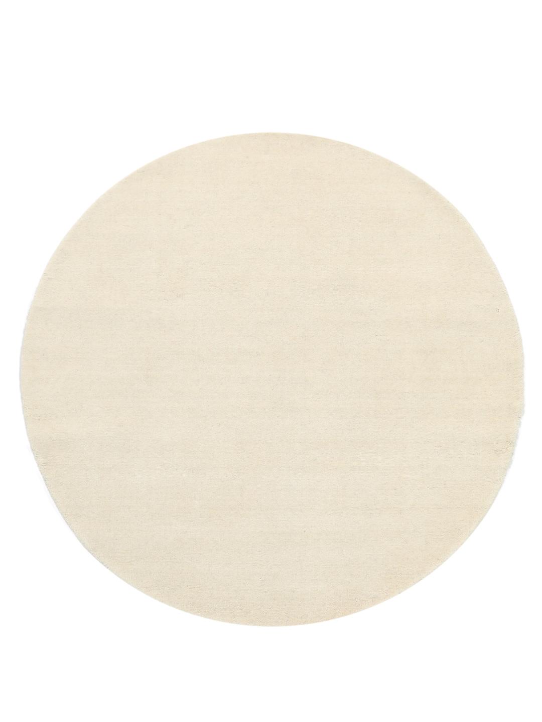 Un tapis rond blanc Handloom fabriqué en laine