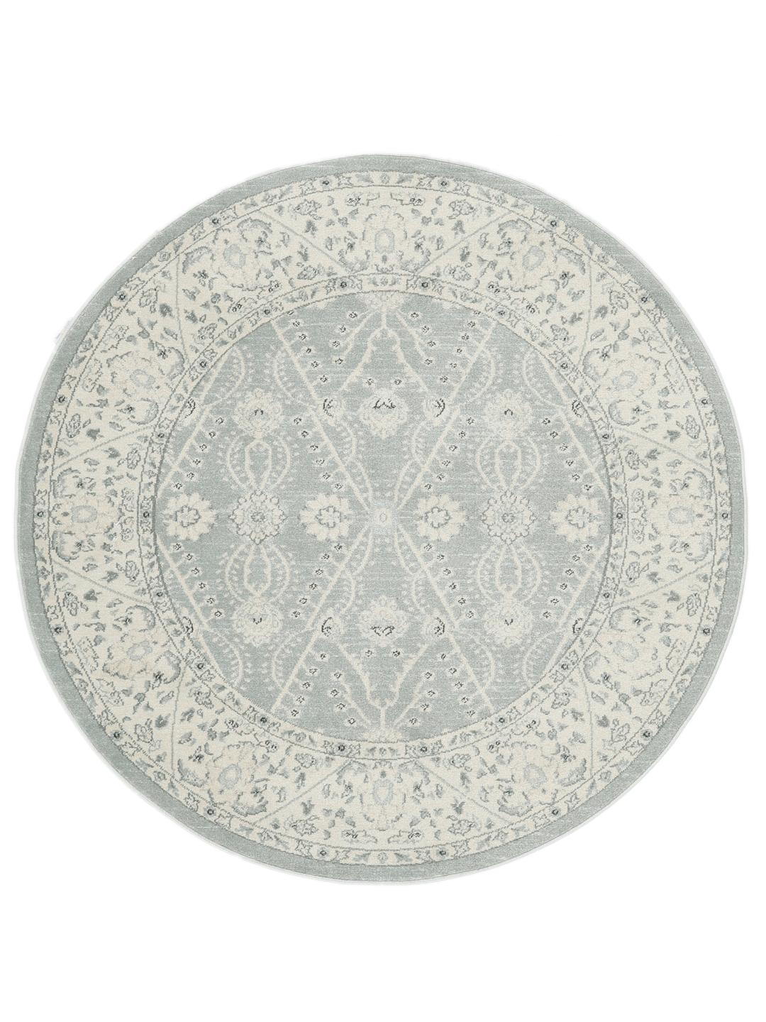 Rond vloerkleed in lichtblauw en crèmekleurig beige met een traditioneel patroon