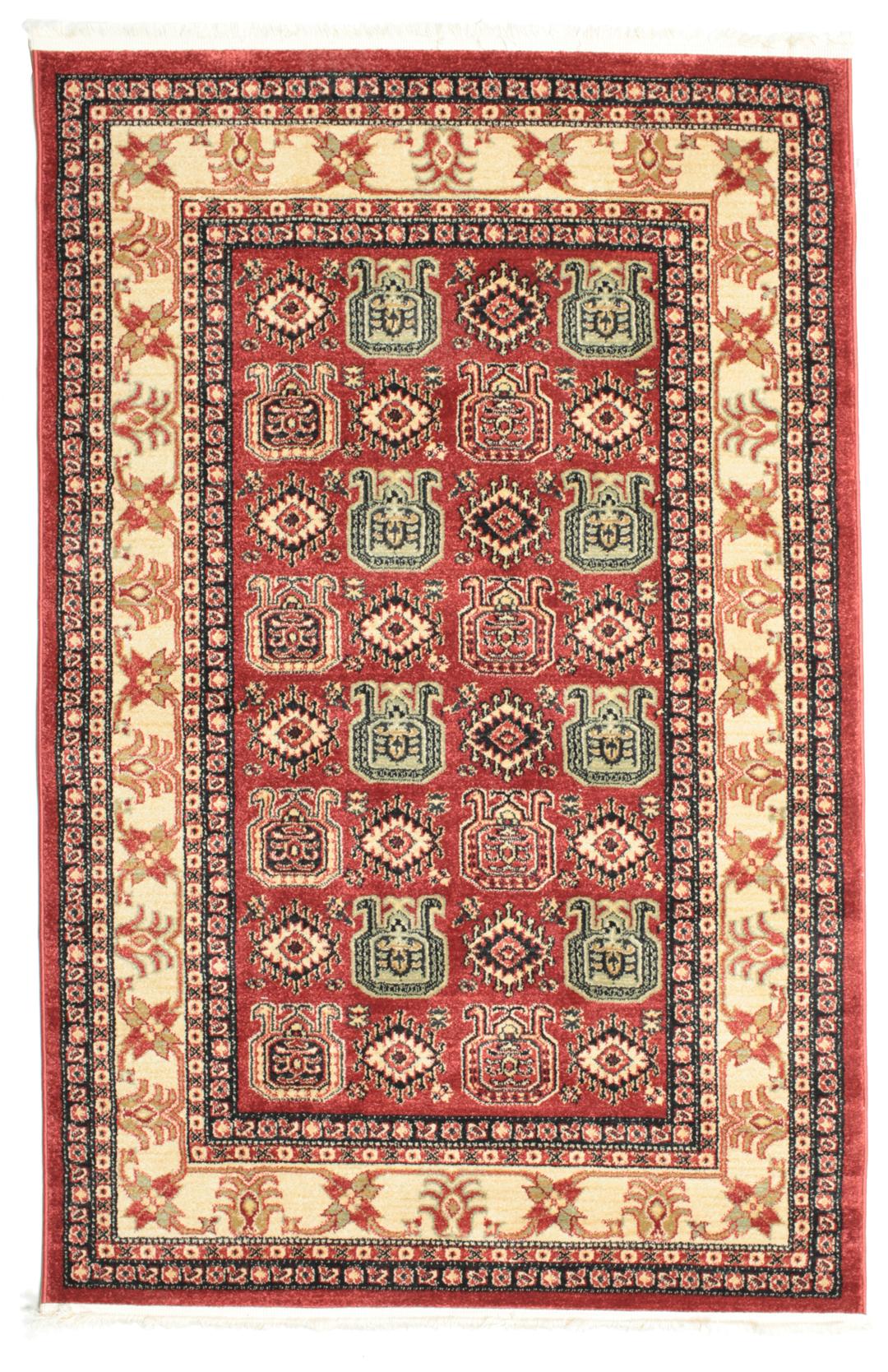 rood vloerkleed met gedetailleerde motieven en franjes