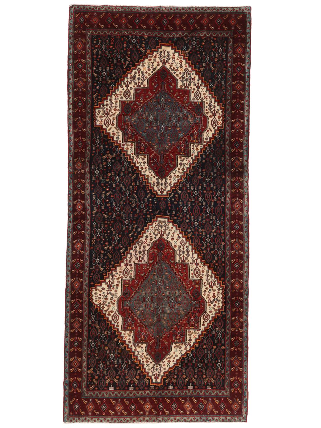 Hand-knotted Senneh runner with a dark multicolor medallion pattern
