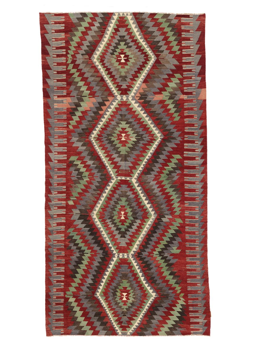 Handgeweven Turks kelimkleed met levendige geometrische patronen in rood, groen en grijs