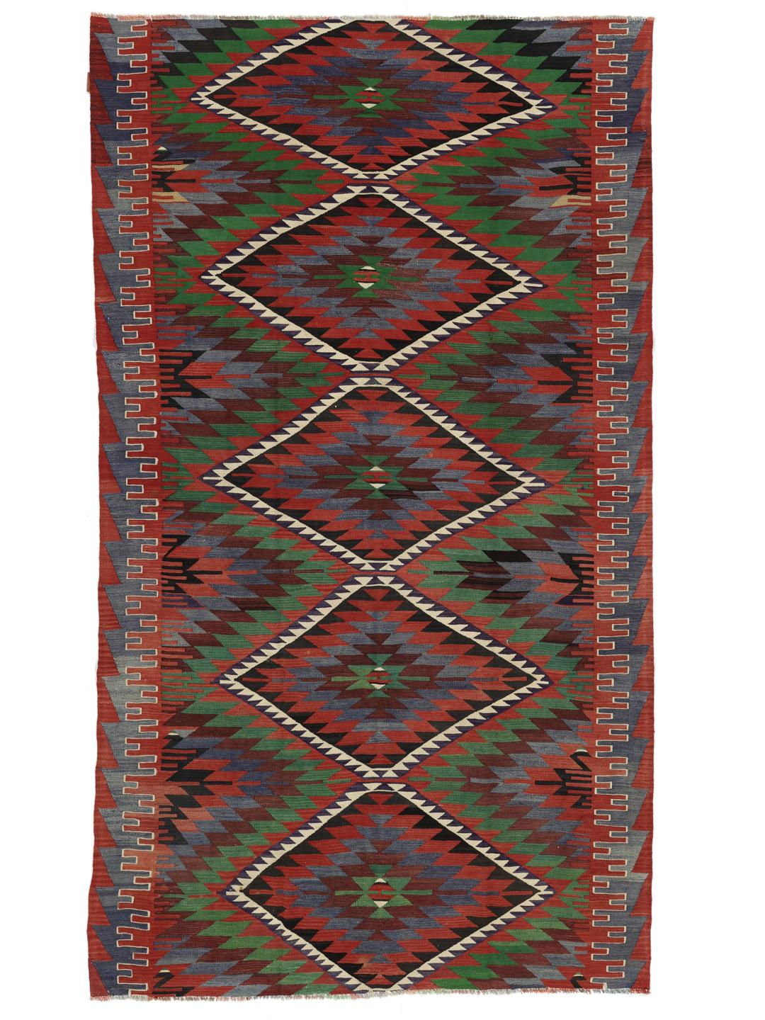 Een kleurrijk vintage Turks Kelim-kleed met geometrische ruitpatronen in rood, groen en blauw.