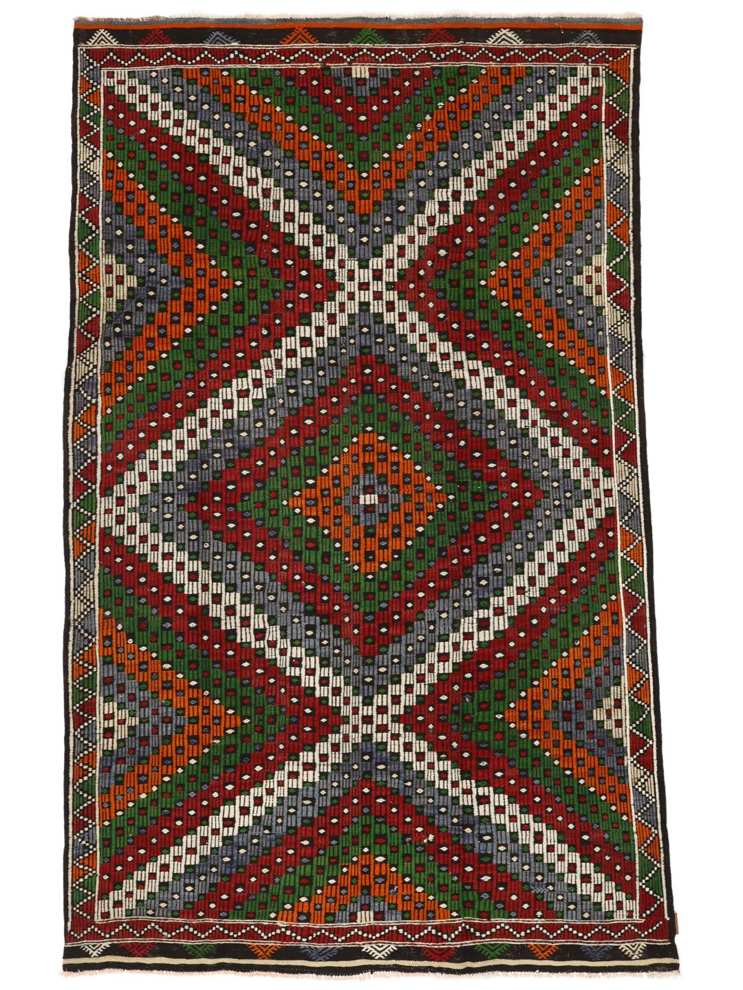 Tapis kilim turc tissé à la main avec des motifs géométriques vibrants dans une palette multicolore