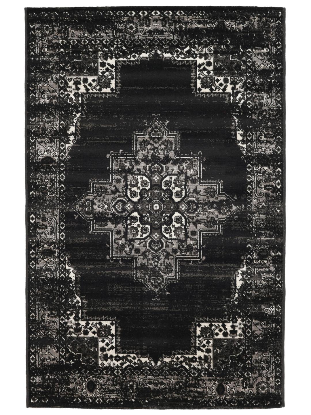 Sort tæppe med et klassisk mønstret design