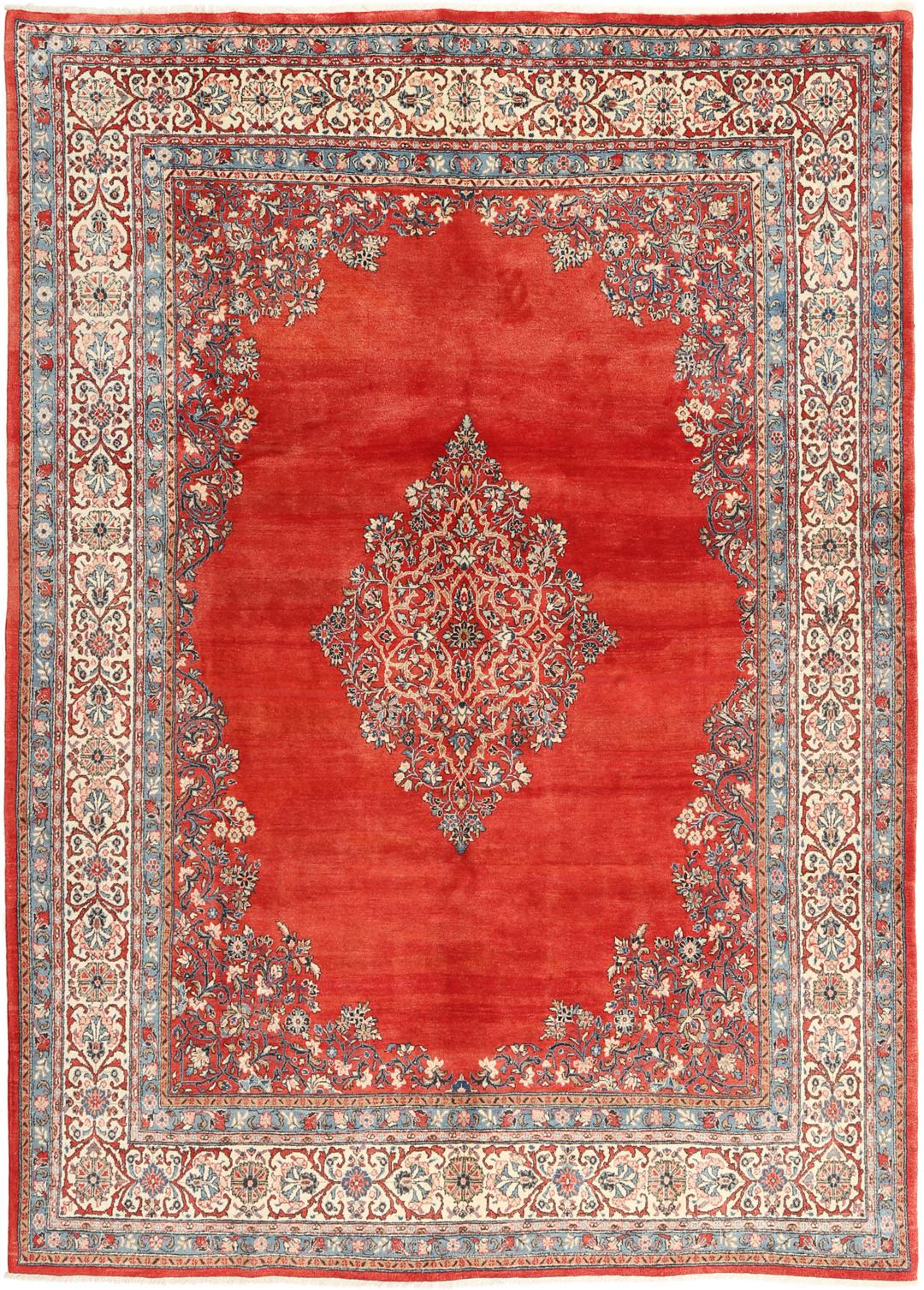 A hand-knotted Sarough rug from the Middle East featuring a red field and intricate floral medallion.