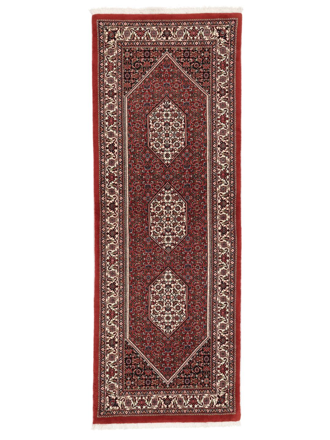Handgeknoopte Bidjar loper in rood met florale zijden accenten