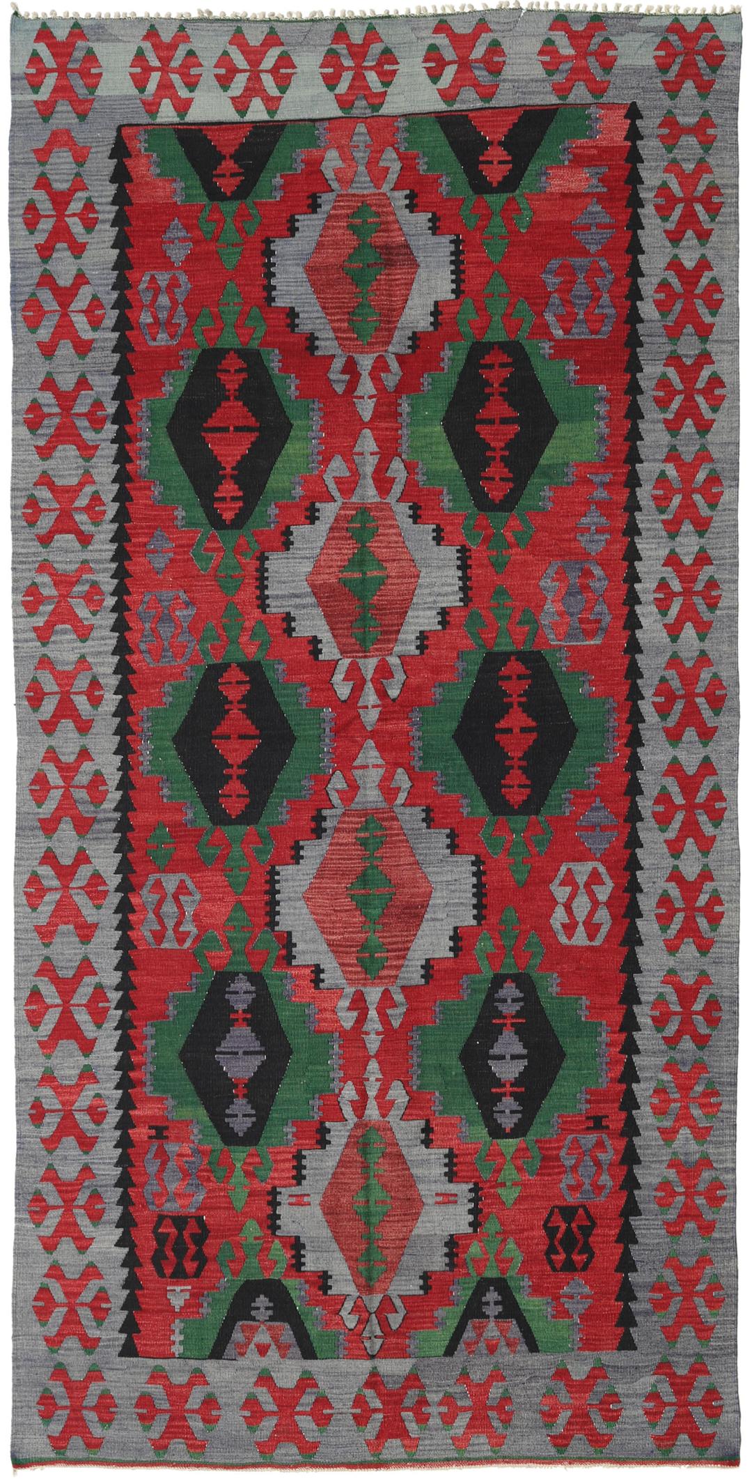 Tapis Kelim turc tissé à la main présentant des motifs géométriques audacieux en rouge, vert et noir