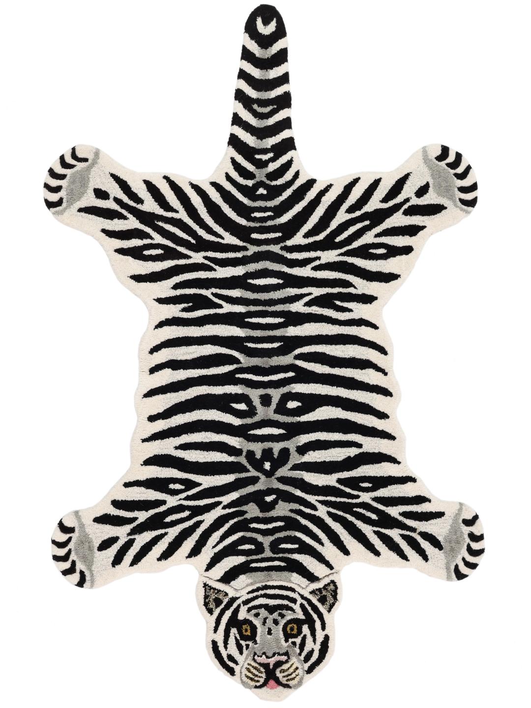 Tapijt in wit met een diervorm