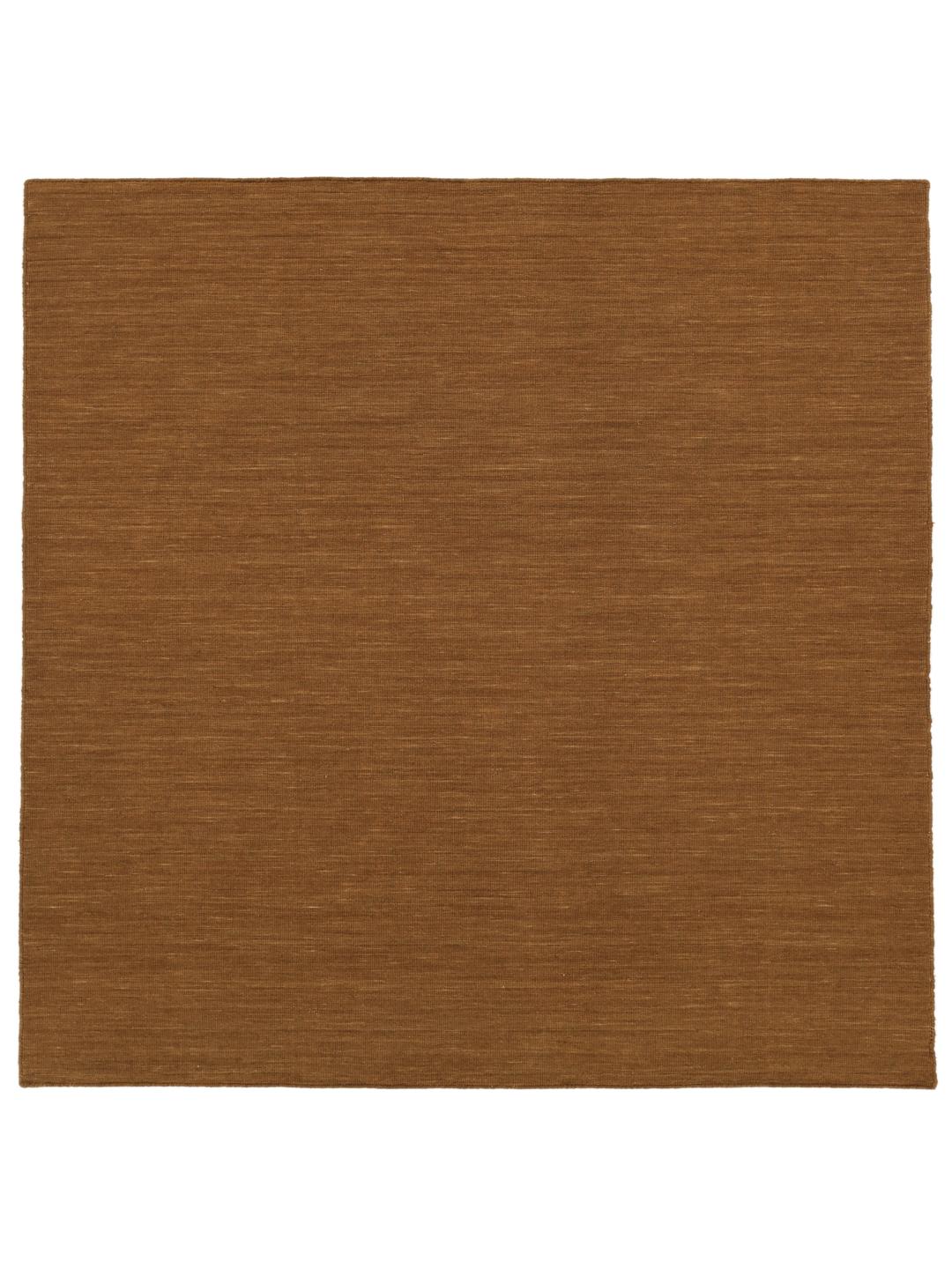 Square brown rug with a flat woven wool texture