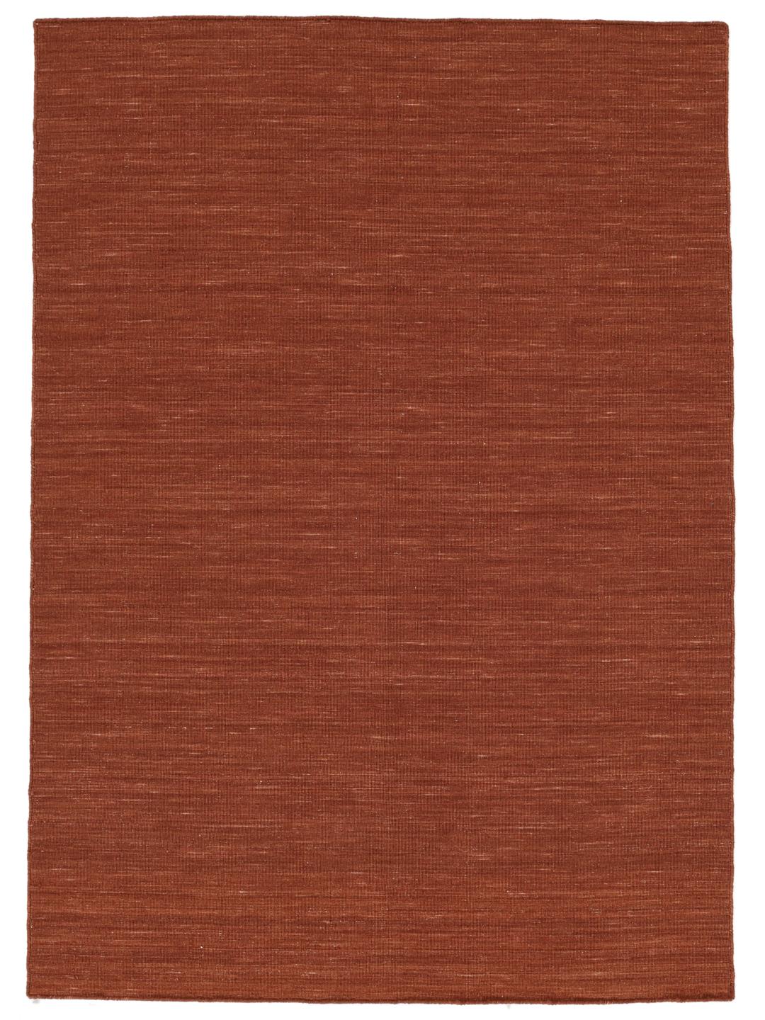 Tæppe i mørkerød farve