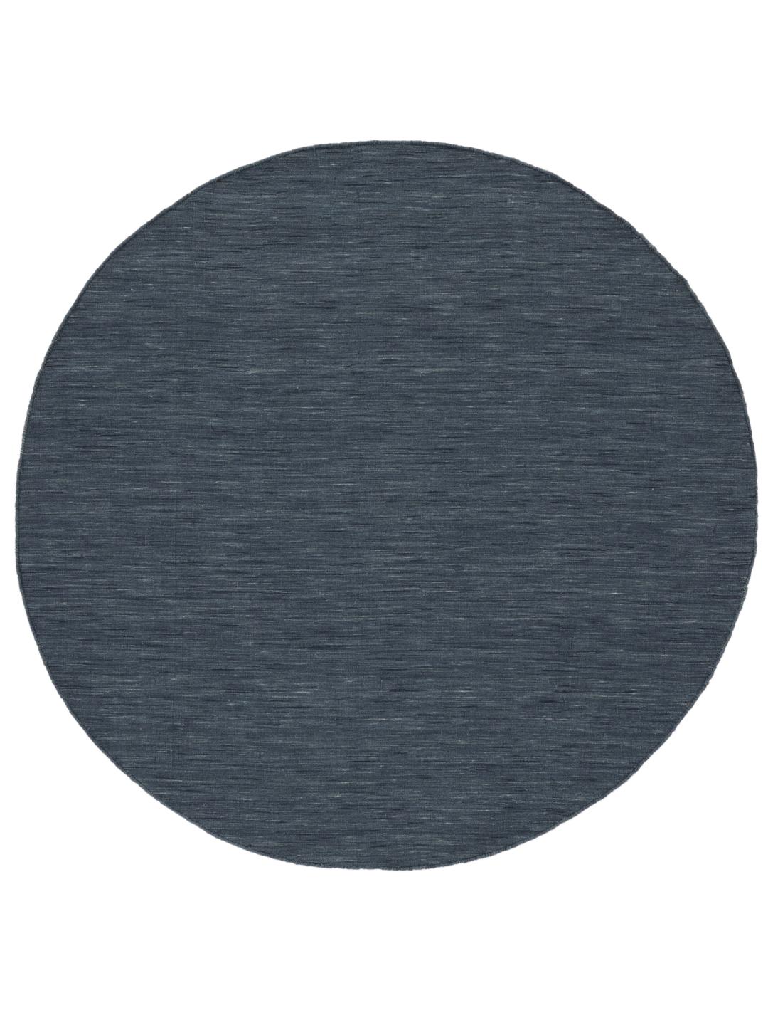 Rundt mørkeblåt håndvævet fladvævet tæppe
