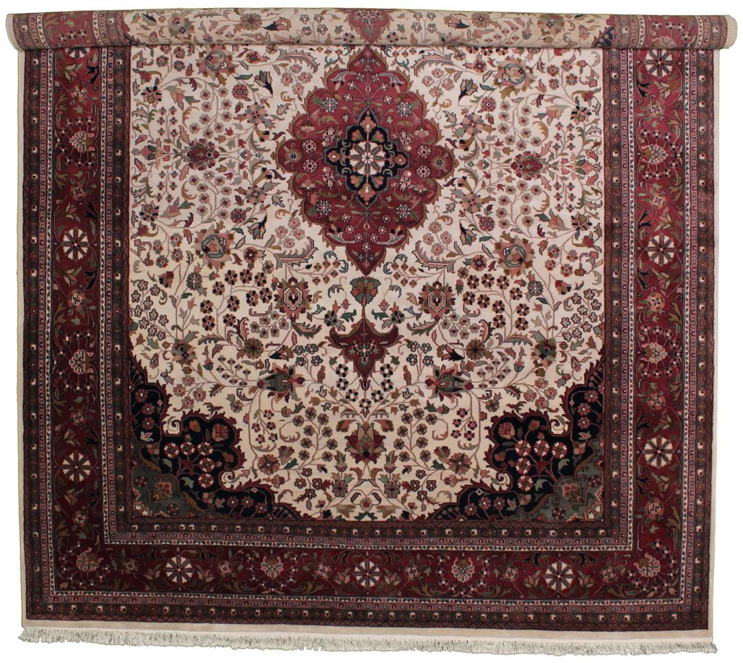 Hand-knotted Tabriz rug from India in red and beige tones