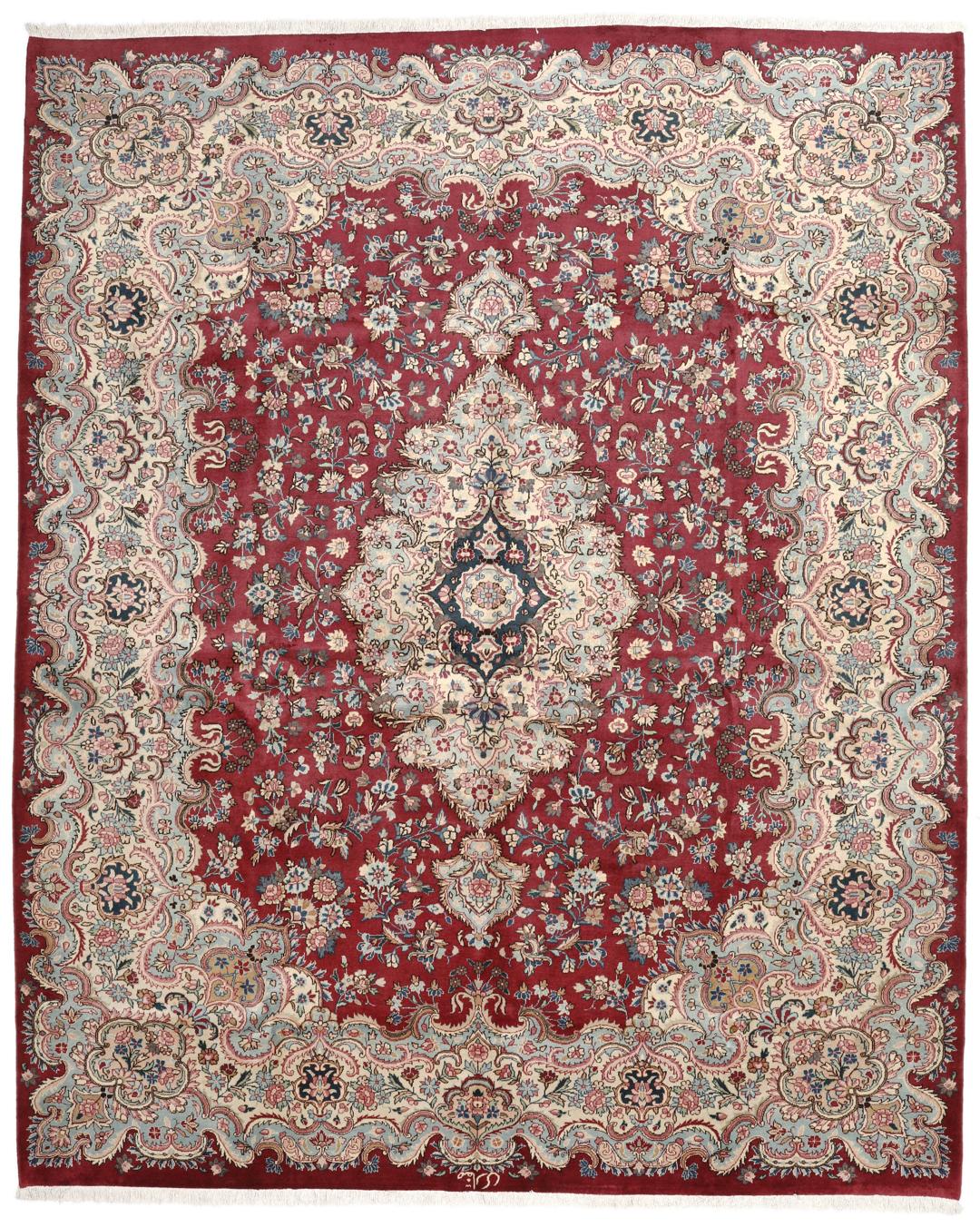 Hand-knotted Mashad rug from the Middle East featuring a dark-red field with intricate floral patterns.