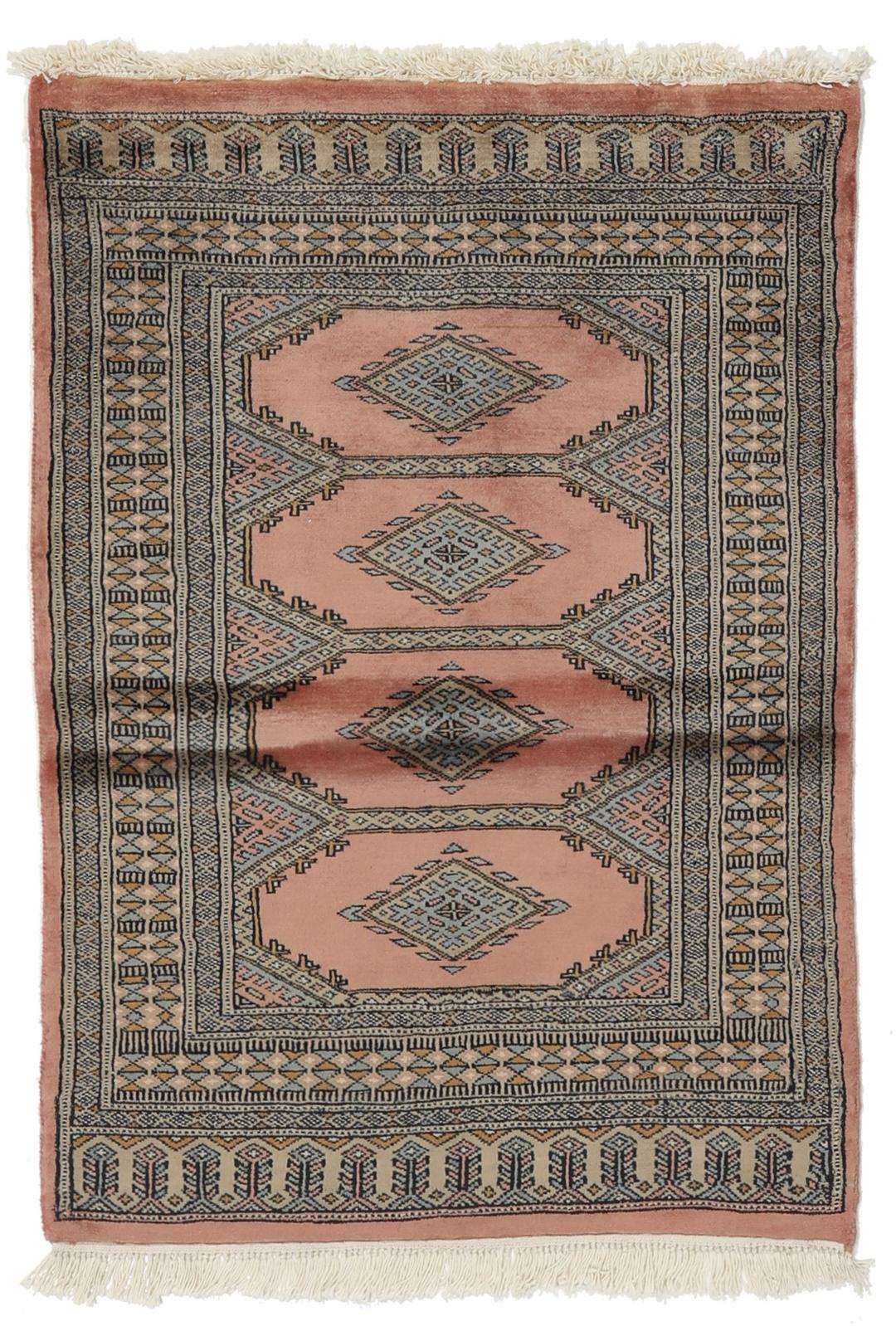 A rectangular Pakistan Bokhara rug with pink field and geometric medallion motifs