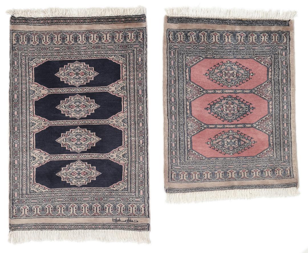 Hand-knotted rug from Pakistan with dark-blue and pink detailing