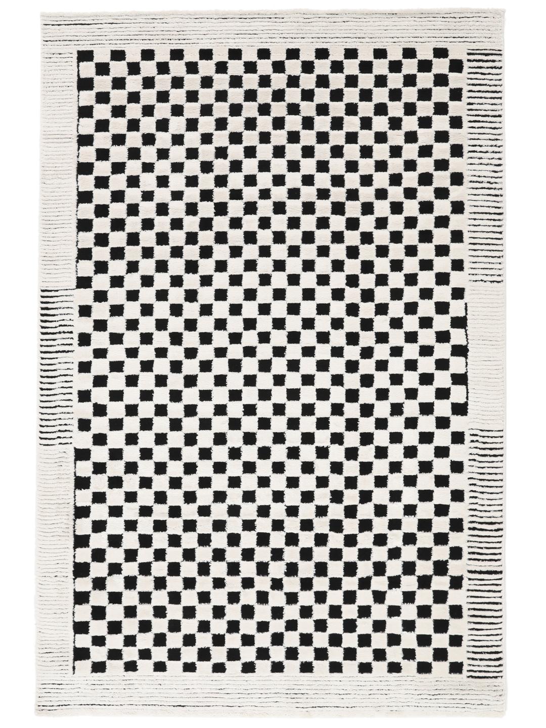 Tapis blanc crème et noir avec un motif structuré