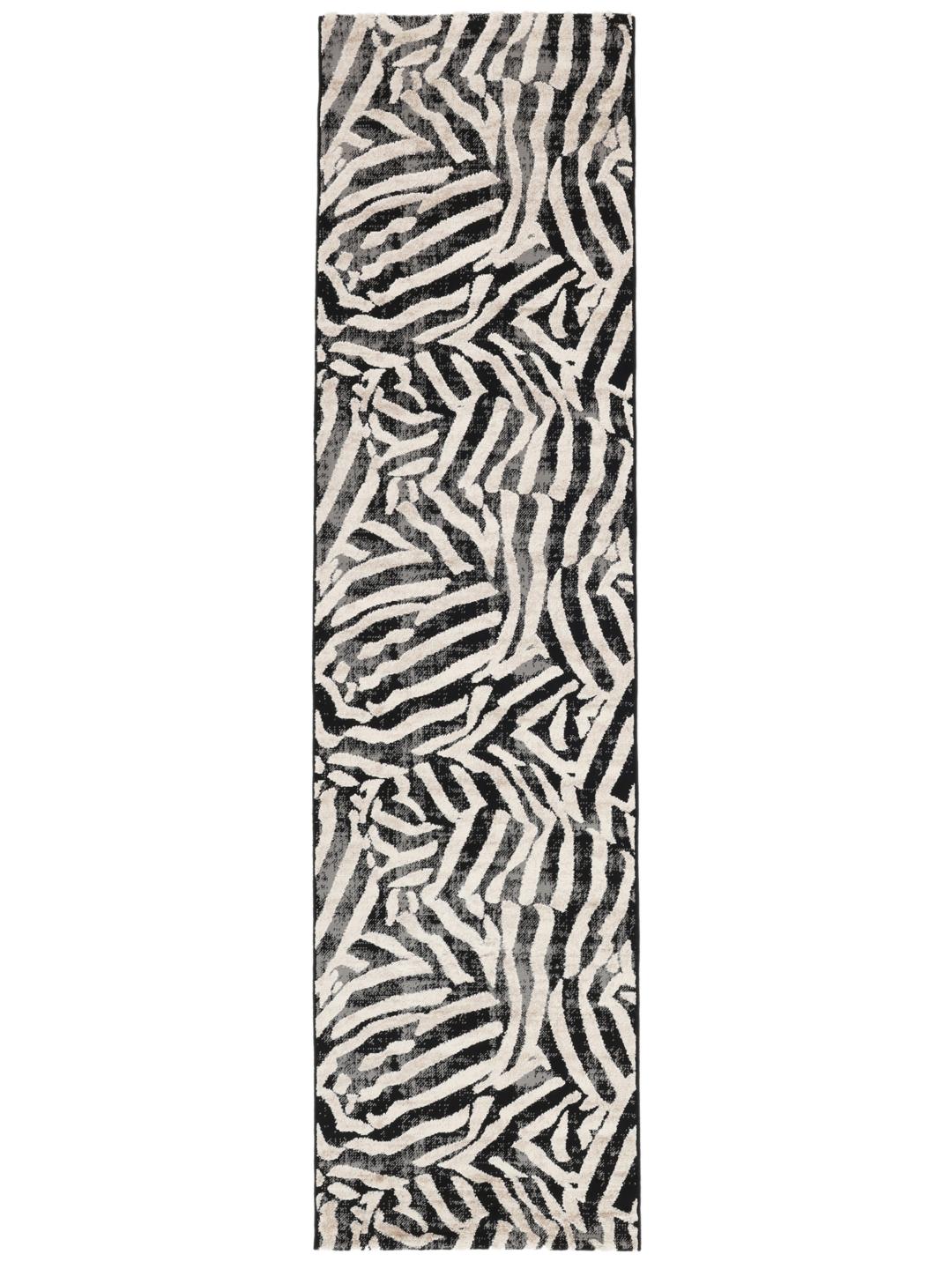 Vloerkleed in zwart en beige met een dierenmotief