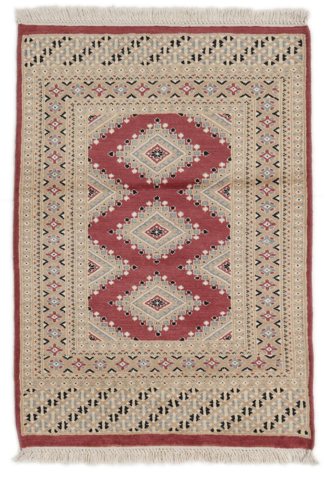 A hand-knotted red Pakistan Bokhara 2ply rug with geometric diamond motifs.