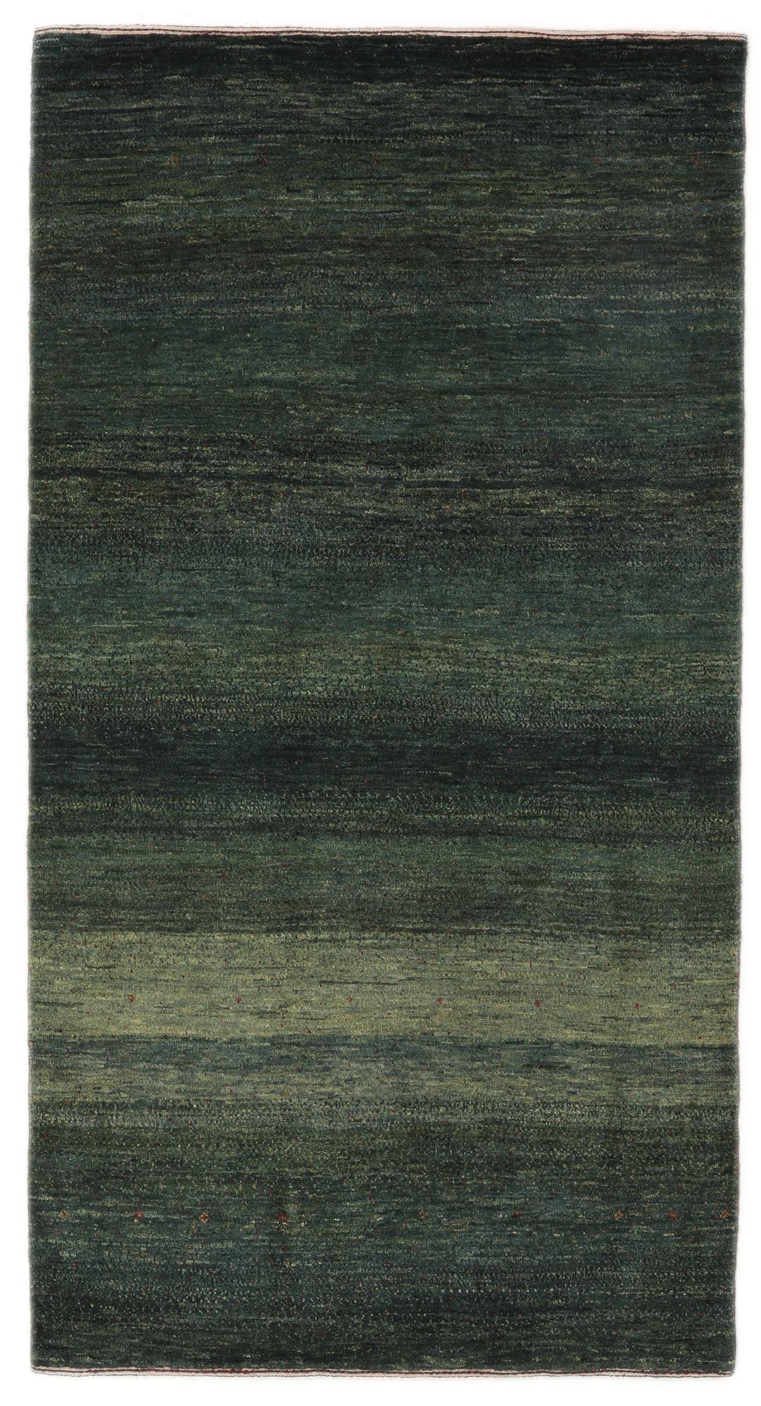 Hand-knotted Loribaft rug from the Middle East in deep forest green and earthy tones