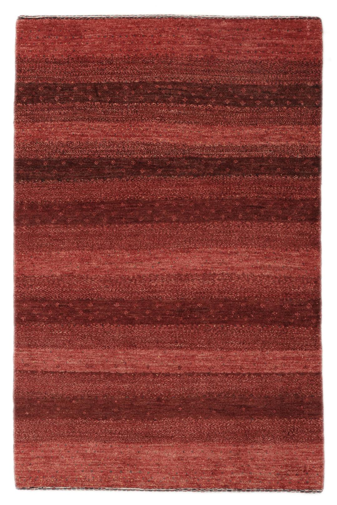 A hand-knotted Loribaft Fine rug from the Middle East in deep red tones.