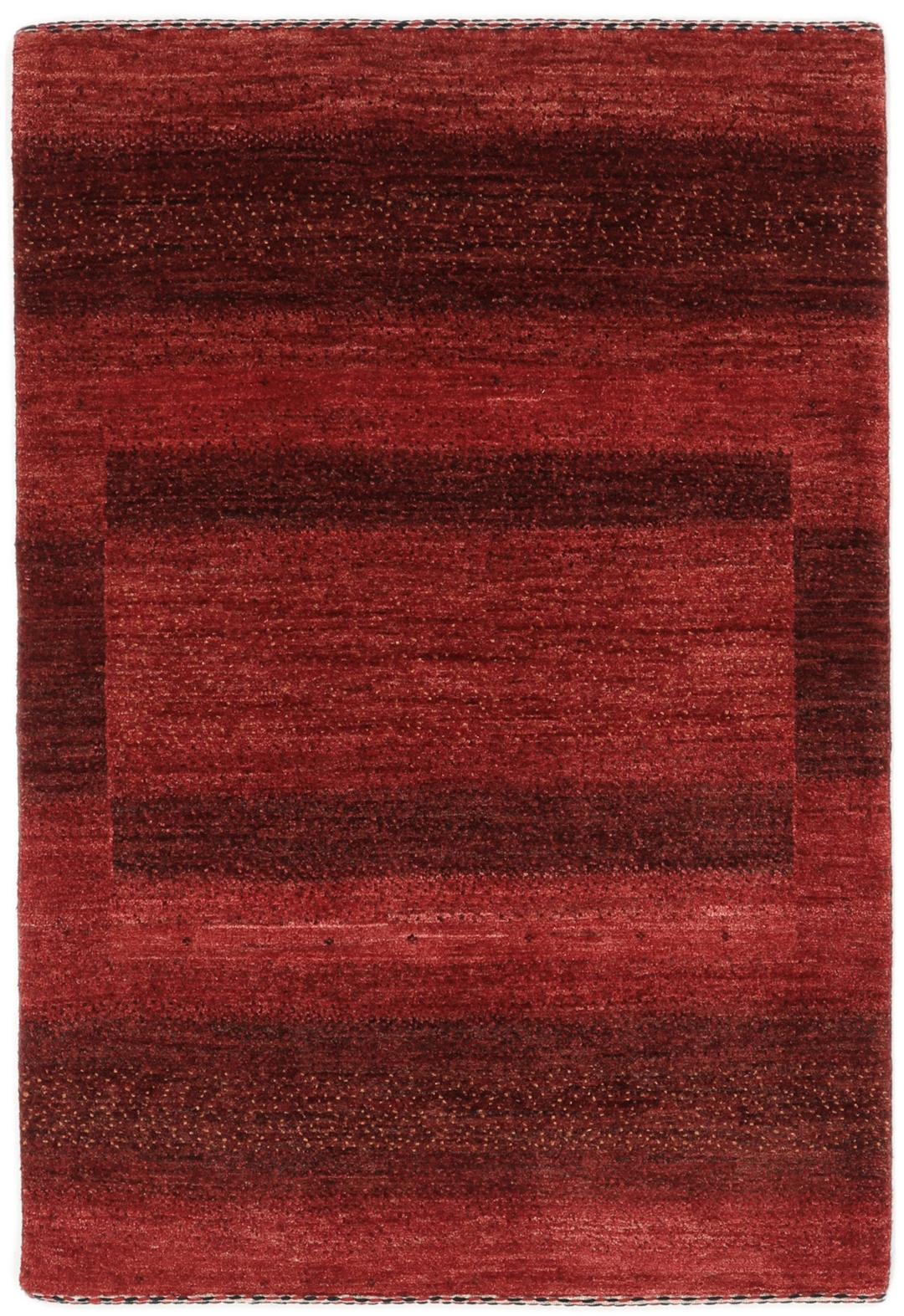 Hand-knotted red wool rug from the Middle East