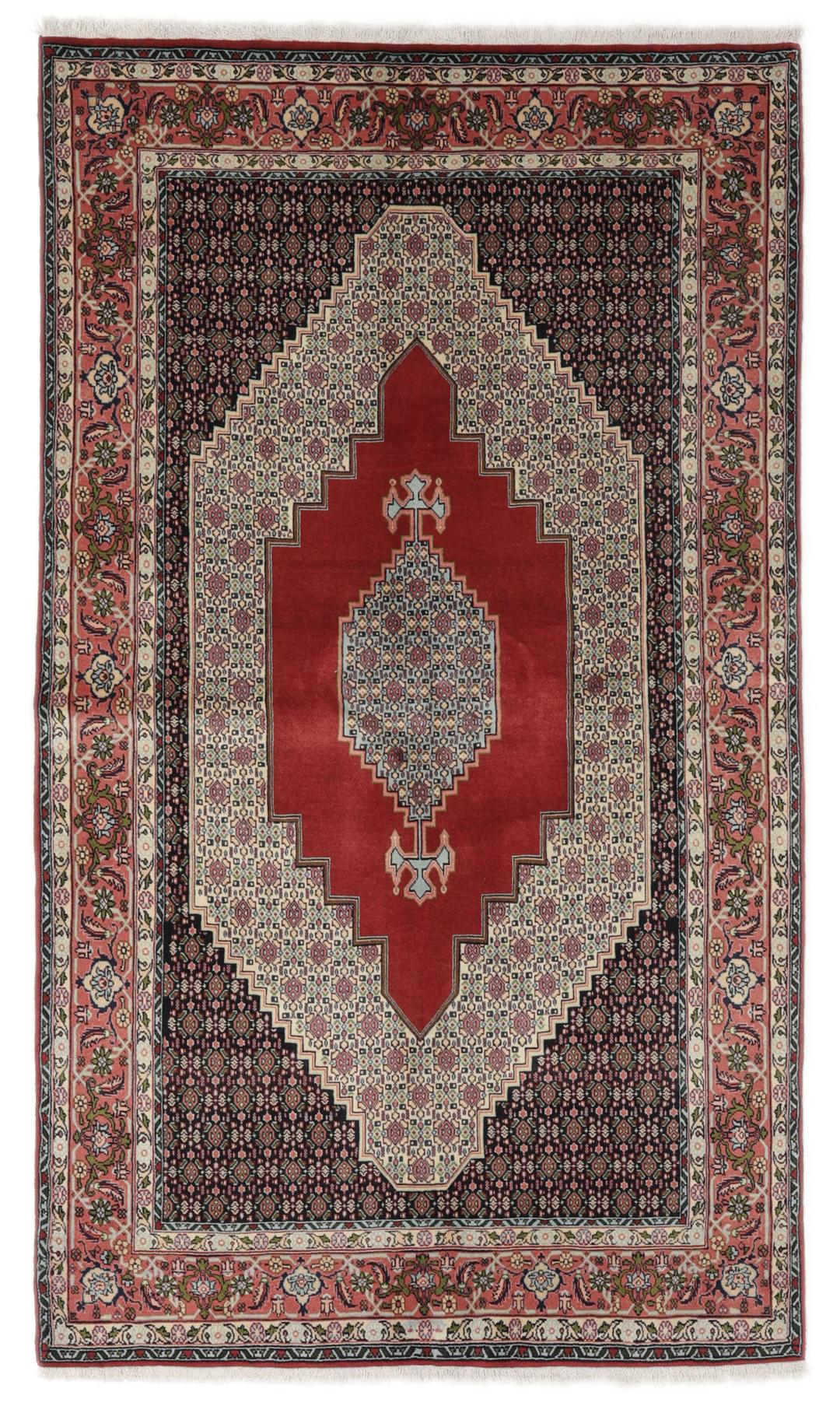 A hand-knotted Senneh rug from the Middle East featuring a dark-red and cream geometric medallion design.