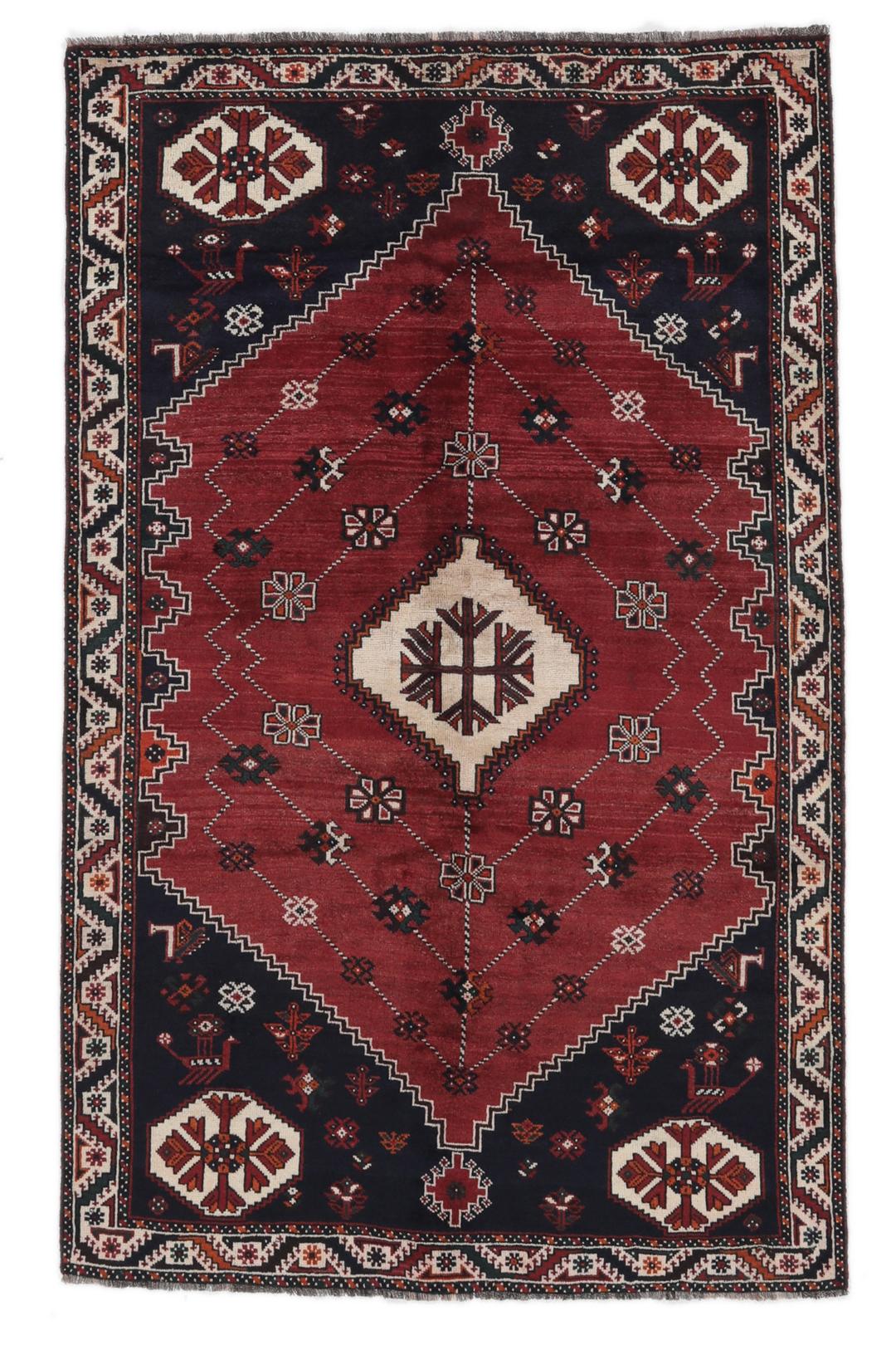 Hand-knotted Shiraz rug from the Middle East in dark-red and black tones.