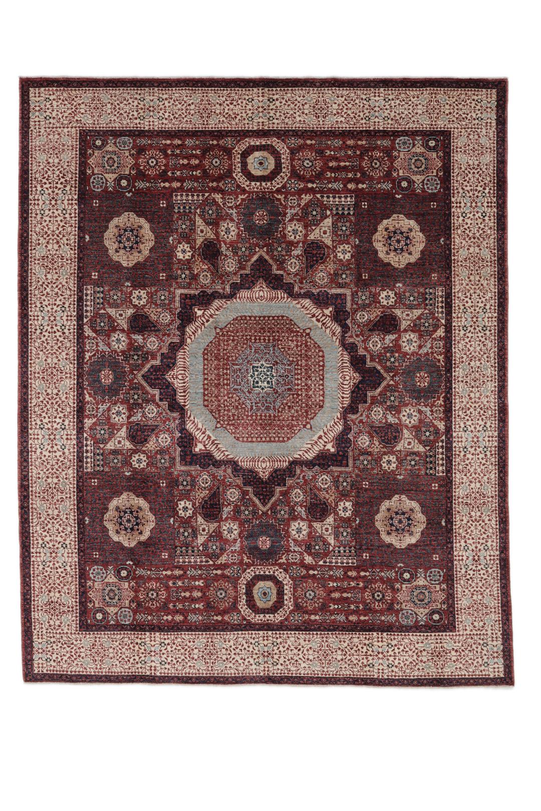 Et håndknyttet Mamluk-tæppe fra Afghanistan i røde og beige nuancer.