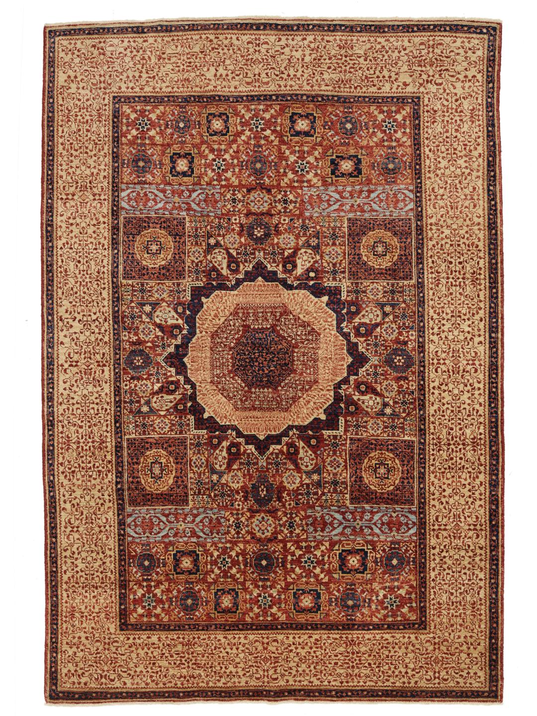 Et håndknyttet Mamluk-tæppe fra Afghanistan i røde og beige toner.