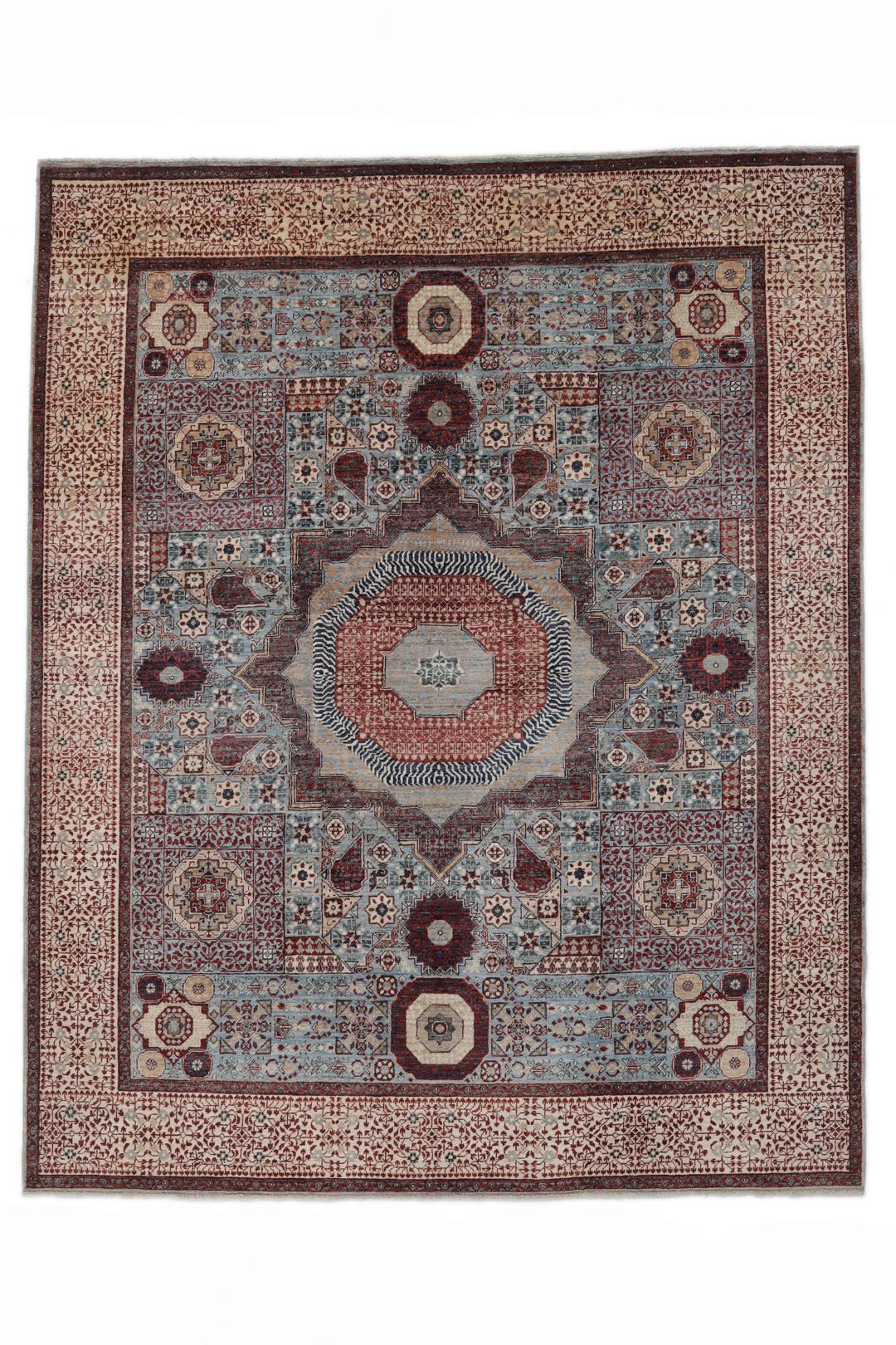 Et håndknyttet Mamluk-tæppe fra Afghanistan med et rødt og blåt geometrisk mønster.