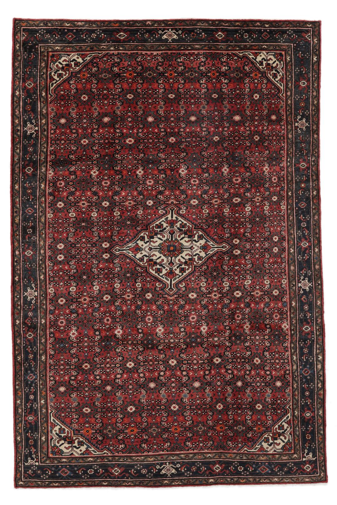 A large hand-knotted Hosseinabad rug from the Middle East featuring red and dark blue tones.