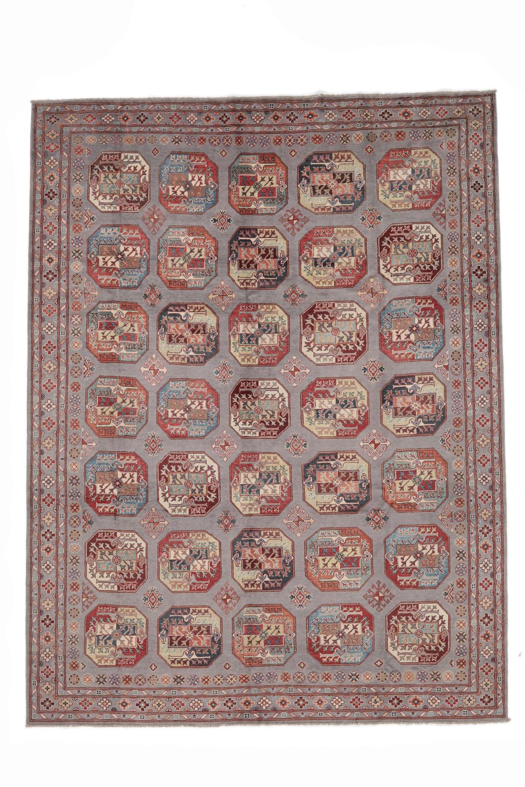 Hand-knotted Afghan Kazak rug with a grey field and geometric medallion motifs.
