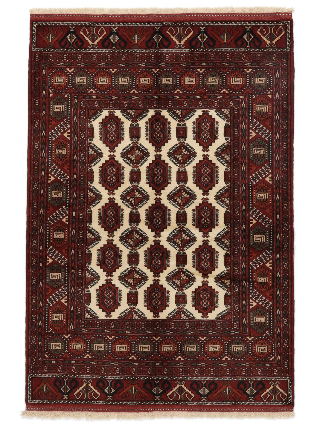 Hand-knotted Turkaman rug from the Middle East featuring a vibrant red and cream colour palette